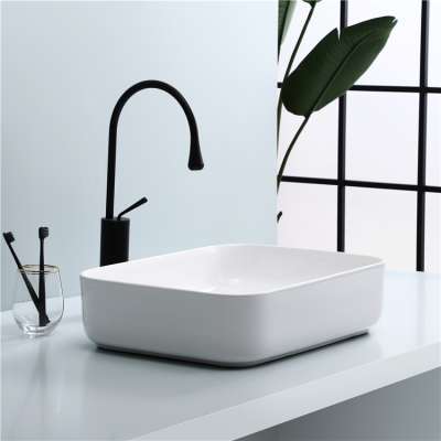 Cheap stylish solid surface rectangular toilet ceramic table top wash basin